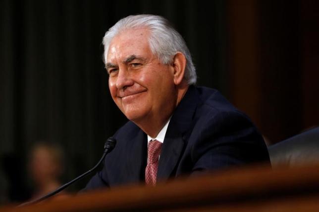 FILE PHOTO - Rex Tillerson, the former chairman and chief executive officer of Exxon Mobil, smiles during his testimony before a Senate Foreign Relations Committee confirmation hearing on his nomination to be U.S. secretary of state in Washington, U.S. January 11, 2017.  REUTERS/Jonathan Ernst